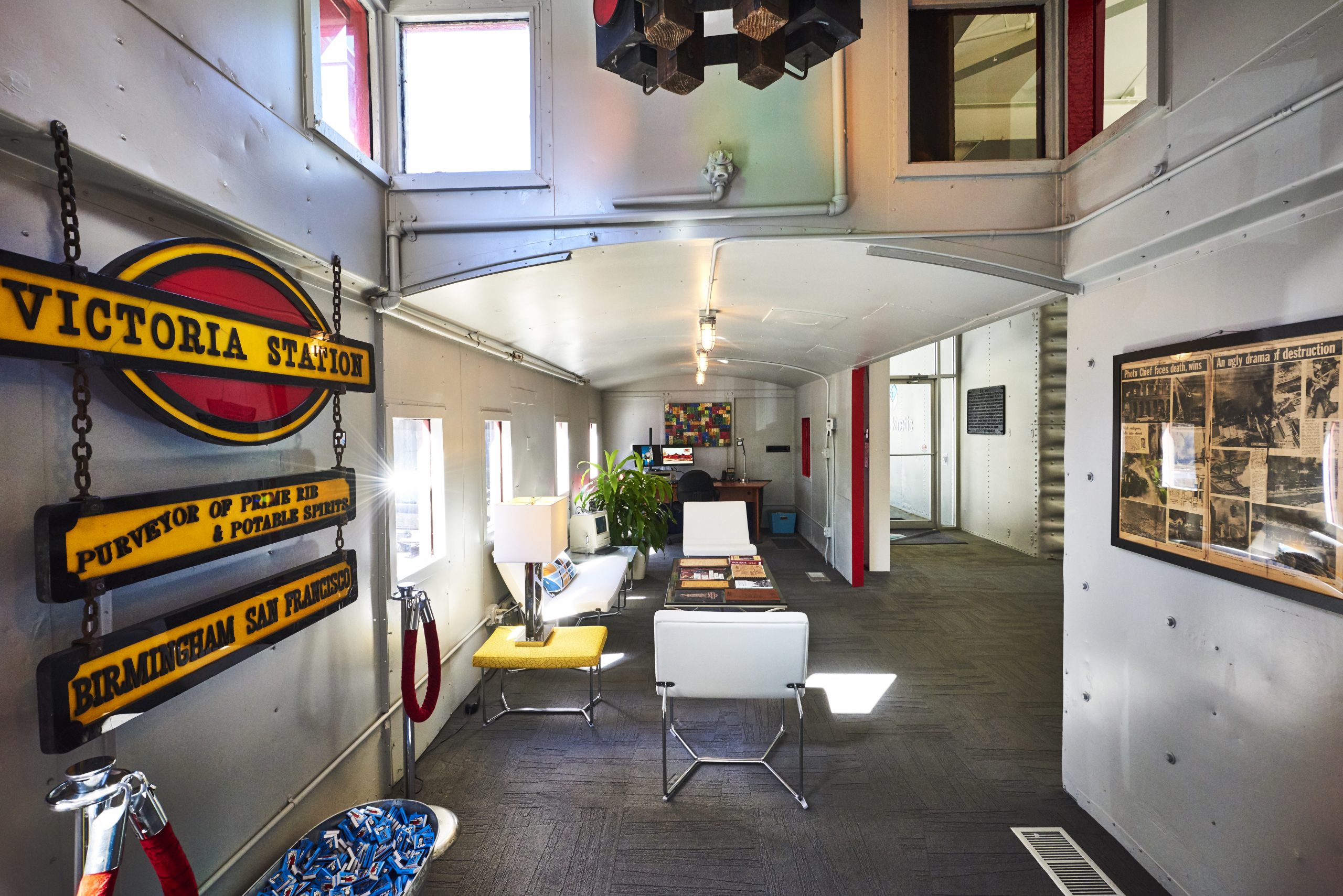 Photo of the the inside of the caboose during daylight hours.