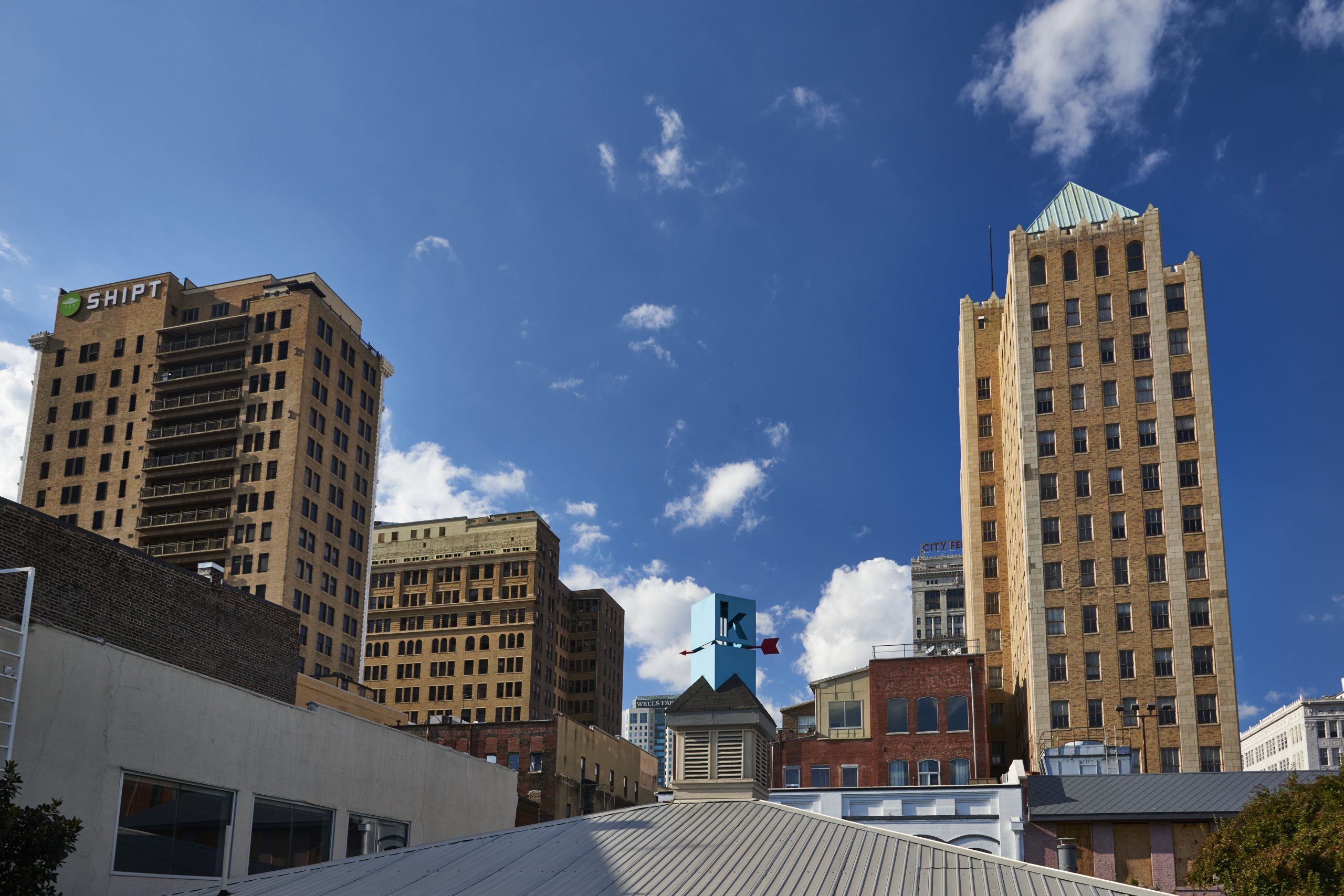 Photo of Kinetic's rooftop logo among other buildings in Birmingham.